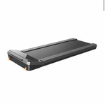 The KingSmith Foldable WalkingPad Z3, a compact black treadmill with a minimalist design and no handrails, features a 1HP brushless motor and max speed of 6km/h. It's shown on a white background.